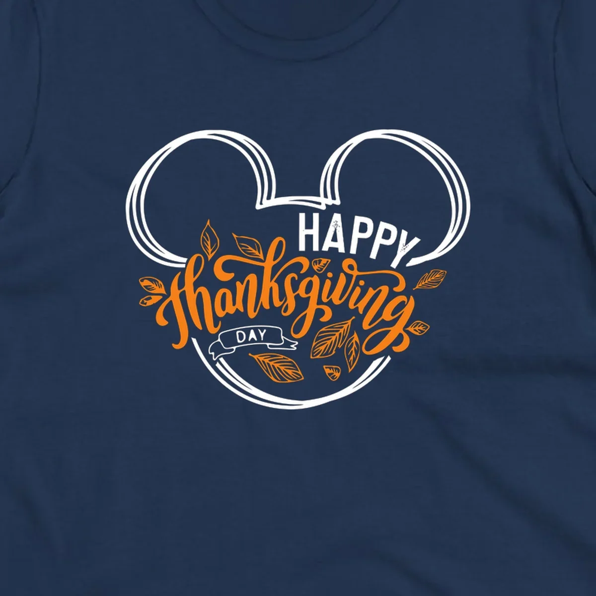 Happy Thanksgiving Day text with Mickey Mouse ears and fall leaves.