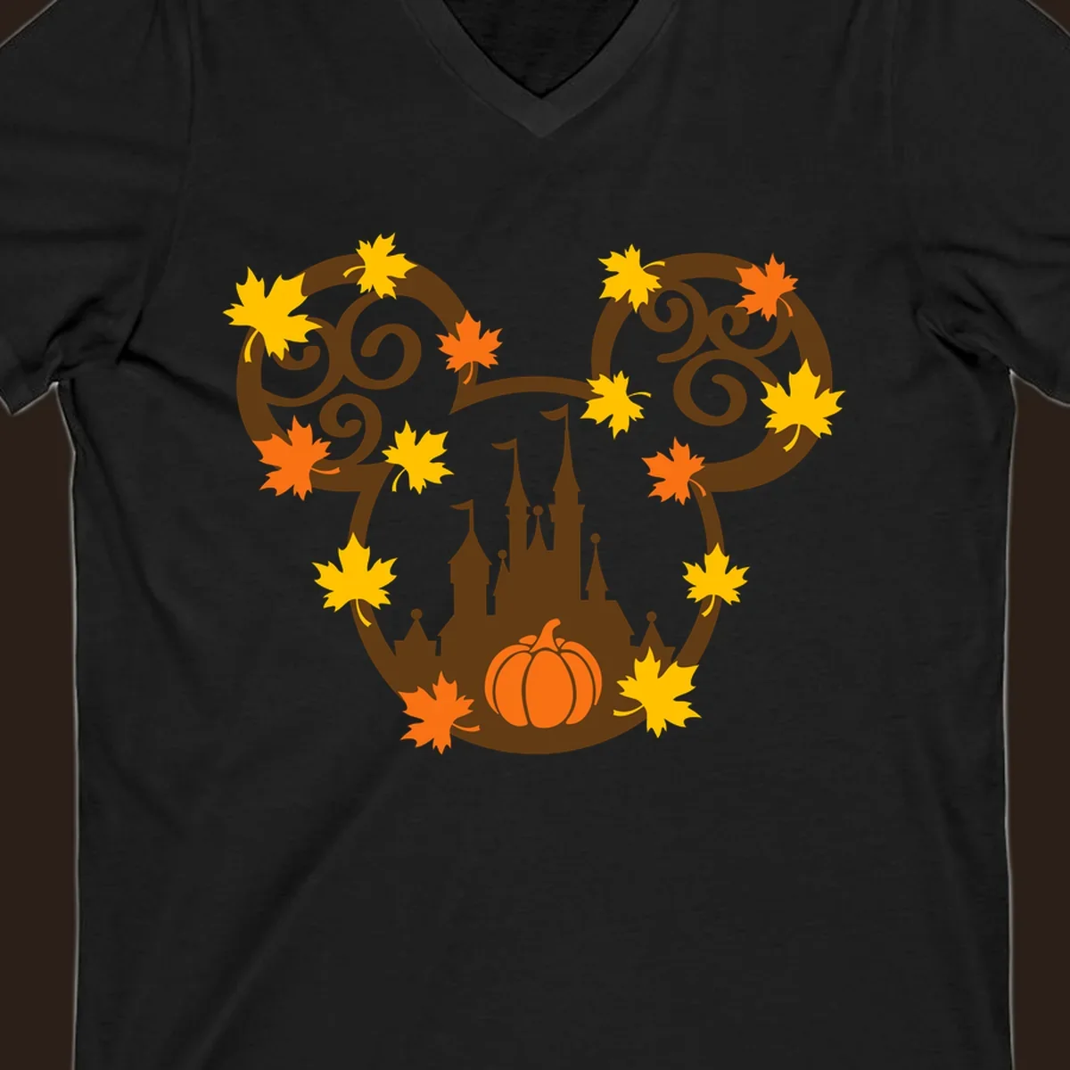 Autumn mickey castle graphic with pumpkin and maple leaves.