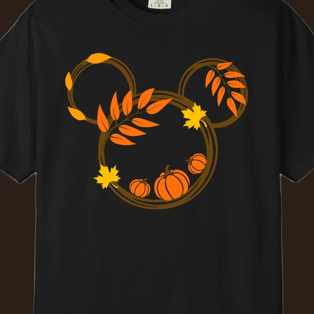Mickey autumn leaves and pumpkins graphic with branches and pumpkins.