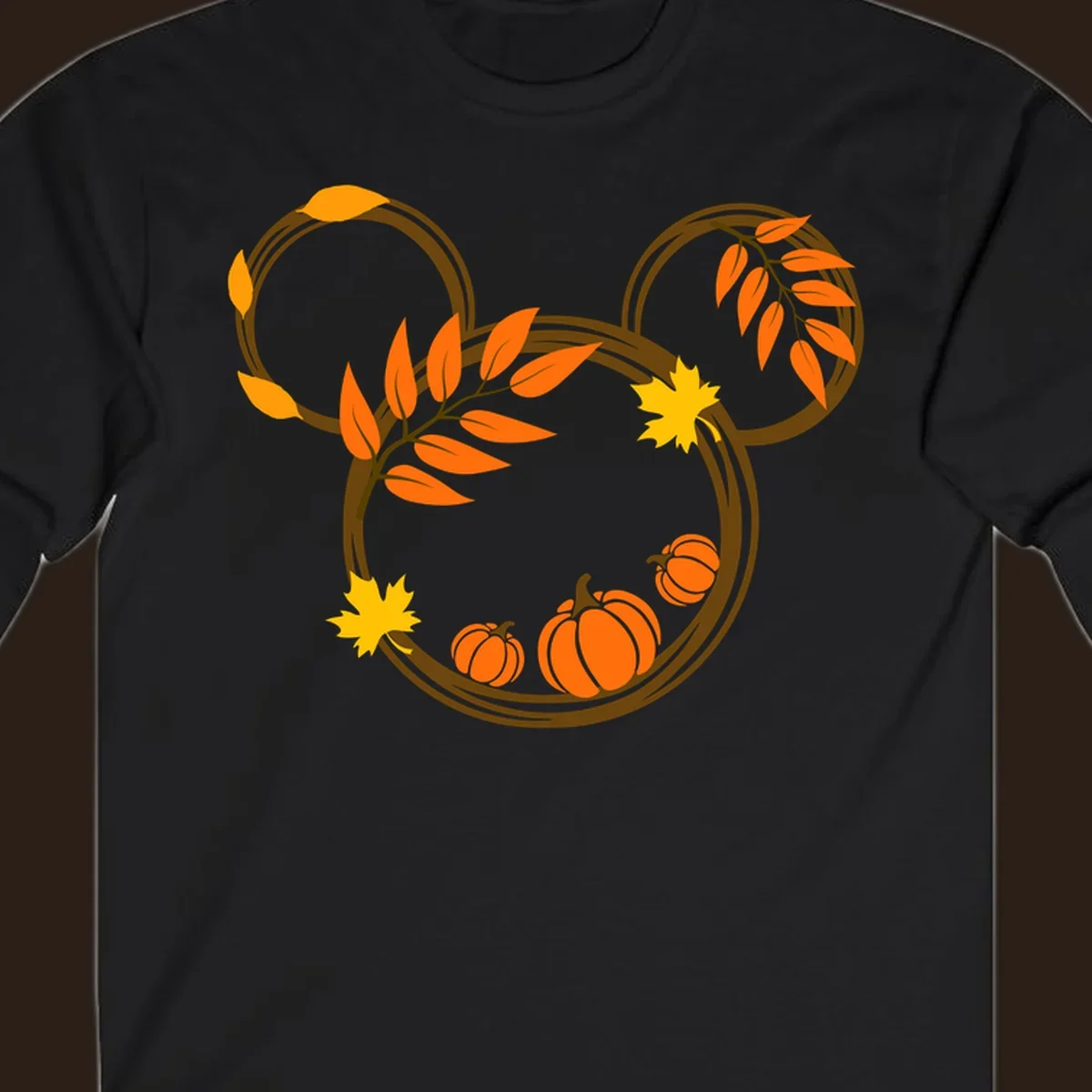 Mickey autumn leaves and pumpkins graphic with branches and pumpkins.