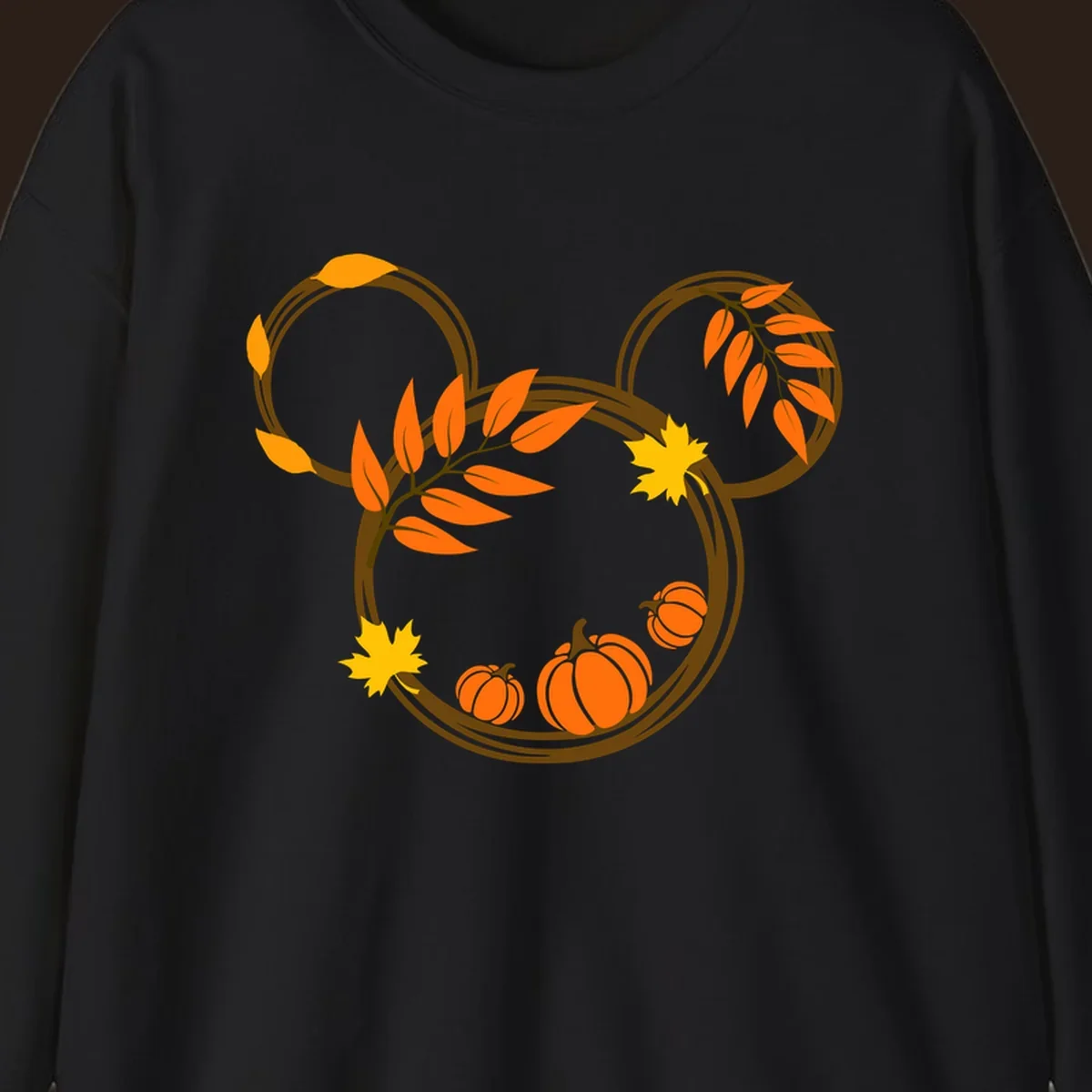 Mickey autumn leaves and pumpkins graphic with branches and pumpkins.