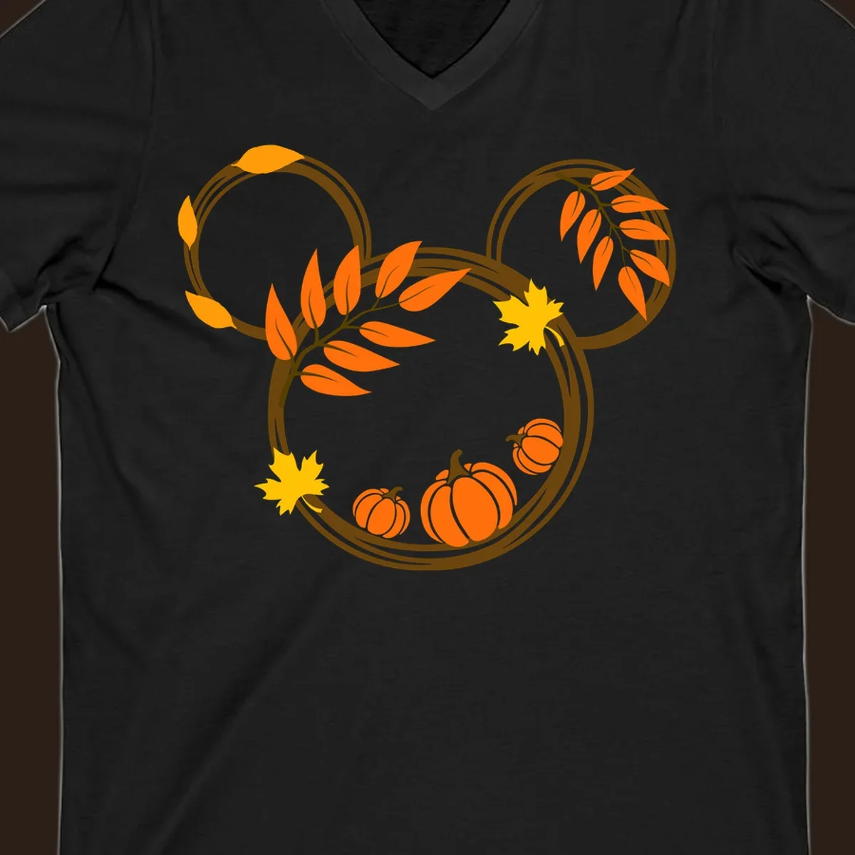 Mickey autumn leaves and pumpkins graphic with branches and pumpkins.