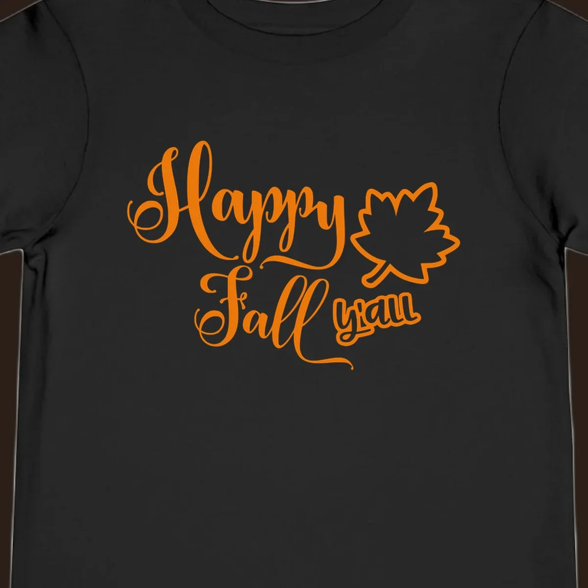 Happy Fall y'all text with autumn leaf outline for Thanksgiving shirts.