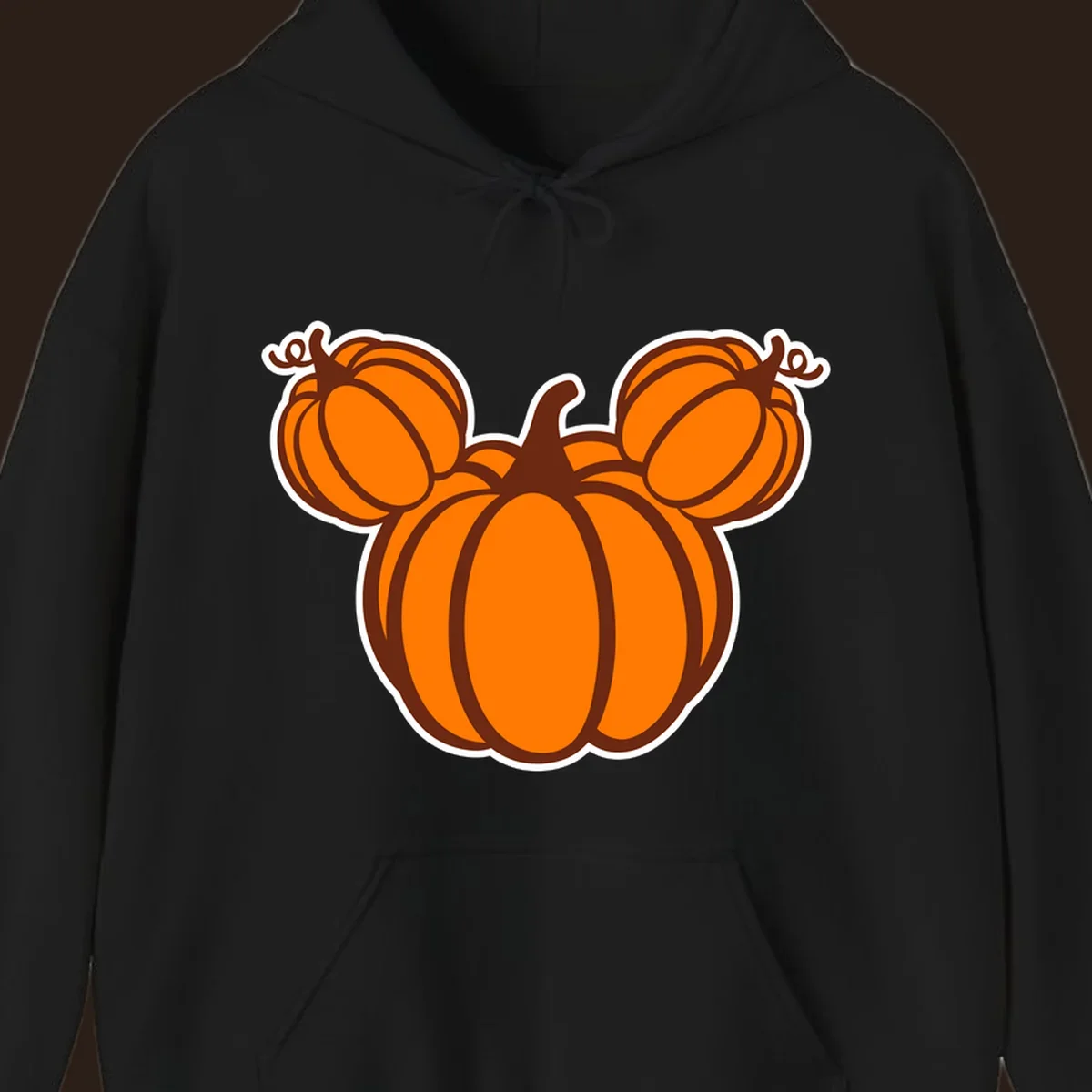 Mickey pumpkin head graphic with orange pumpkins and brown outlines.