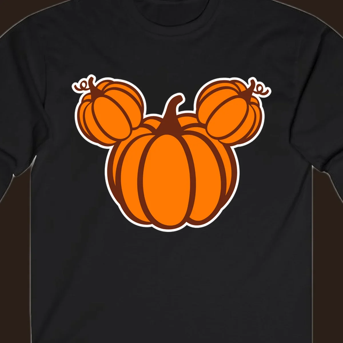 Mickey pumpkin head graphic with orange pumpkins and brown outlines.