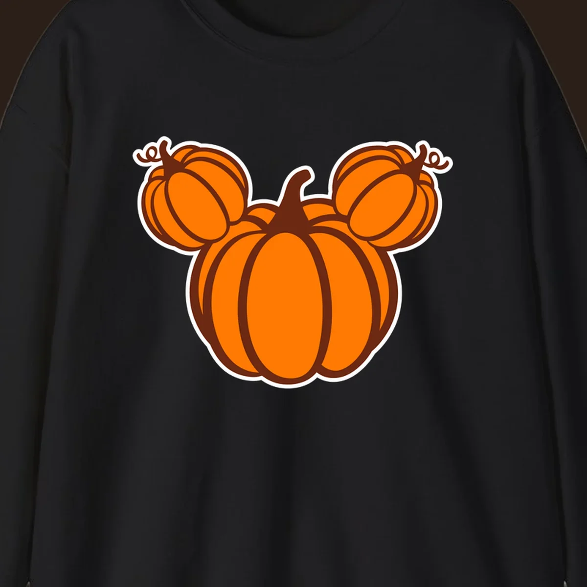 Mickey pumpkin head graphic with orange pumpkins and brown outlines.