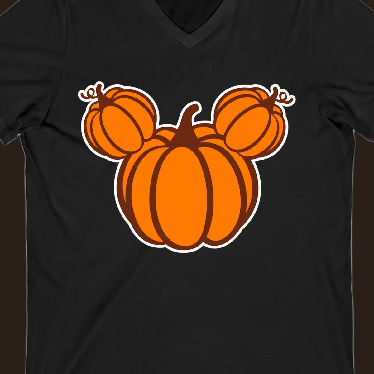 Mickey pumpkin head graphic with orange pumpkins and brown outlines.