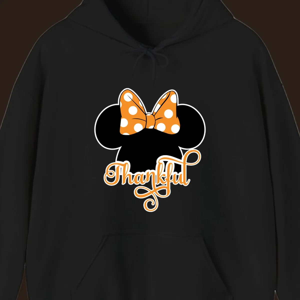 Minnie Mouse ears with orange polka dot bow and "Thankful" text, perfect for Thanksgiving.