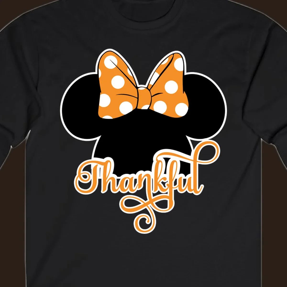 Minnie Mouse ears with orange polka dot bow and "Thankful" text, perfect for Thanksgiving.