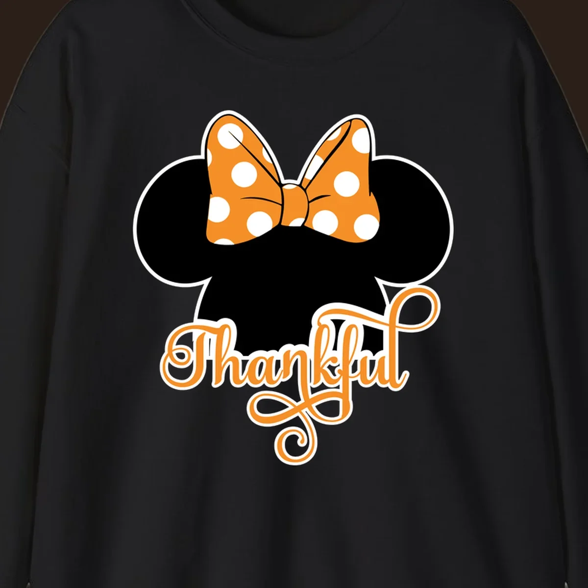 Minnie Mouse ears with orange polka dot bow and "Thankful" text, perfect for Thanksgiving.