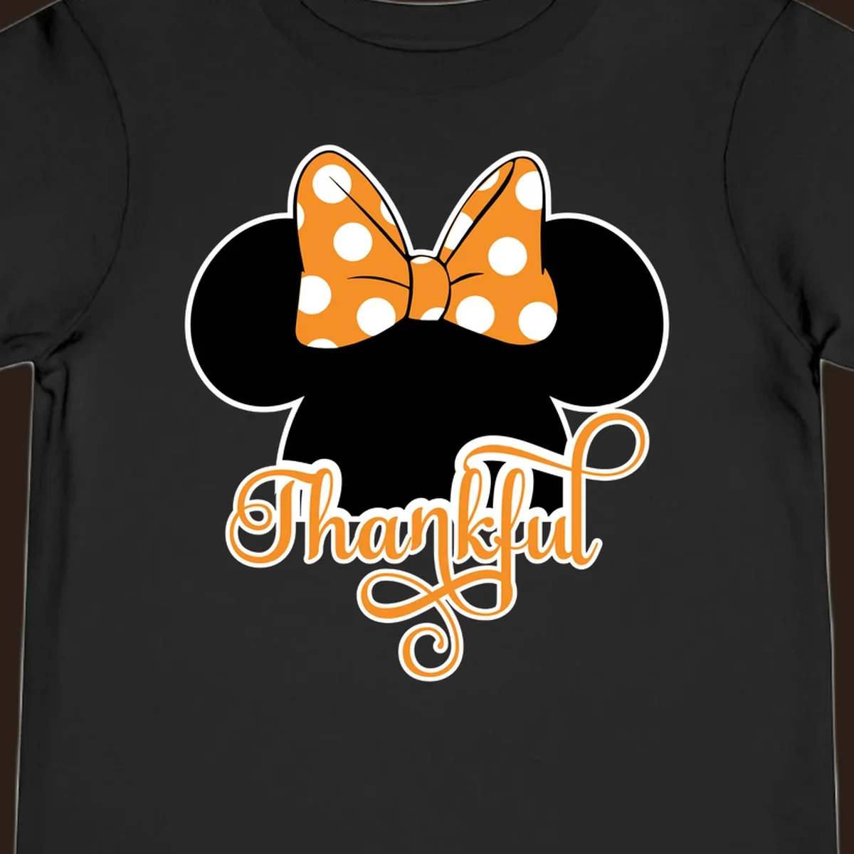 Minnie Mouse ears with orange polka dot bow and "Thankful" text, perfect for Thanksgiving.