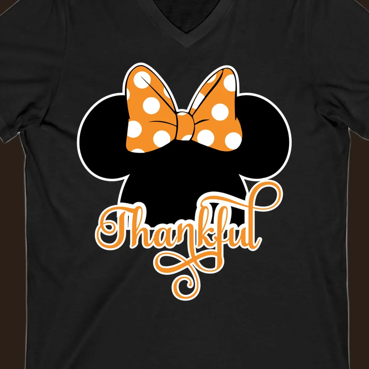 Minnie Mouse ears with orange polka dot bow and "Thankful" text, perfect for Thanksgiving.