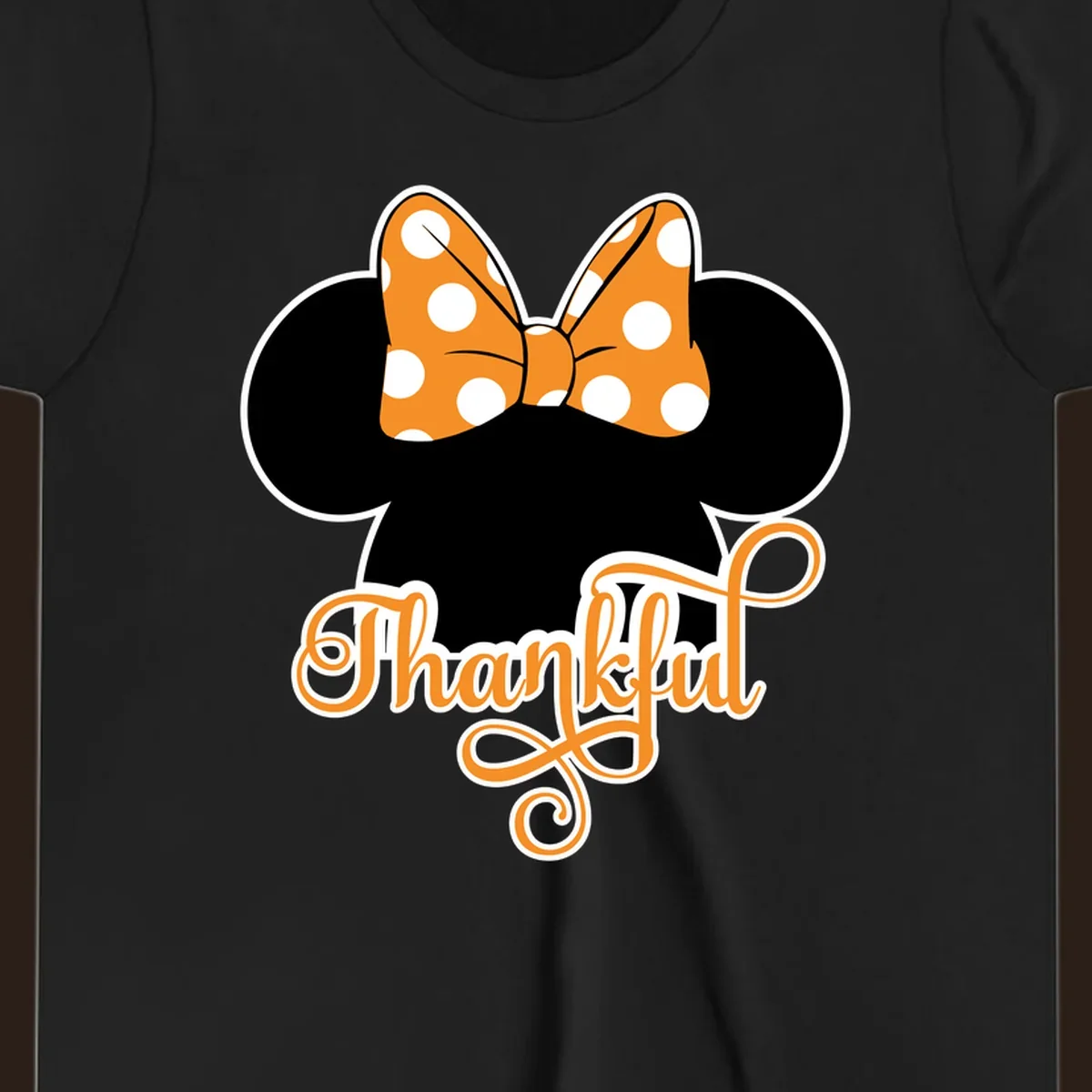 Minnie Mouse ears with orange polka dot bow and "Thankful" text, perfect for Thanksgiving.