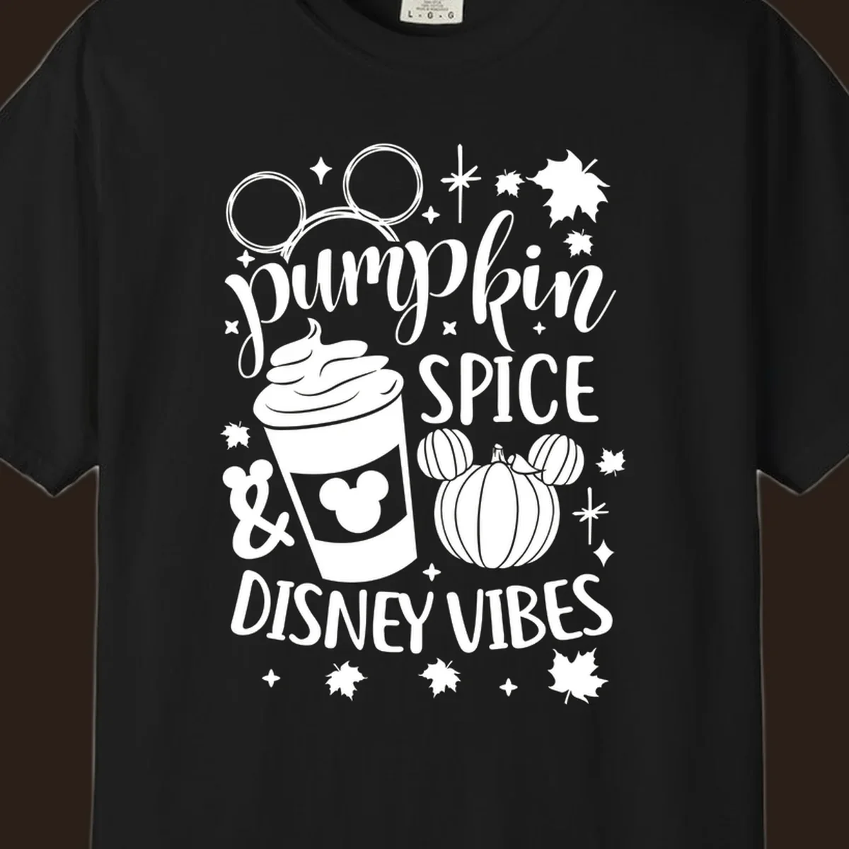 Pumpkin spice and Disney vibes text with Mickey ears, coffee cup, and pumpkin graphic. Pumpkin-spice-disney.
