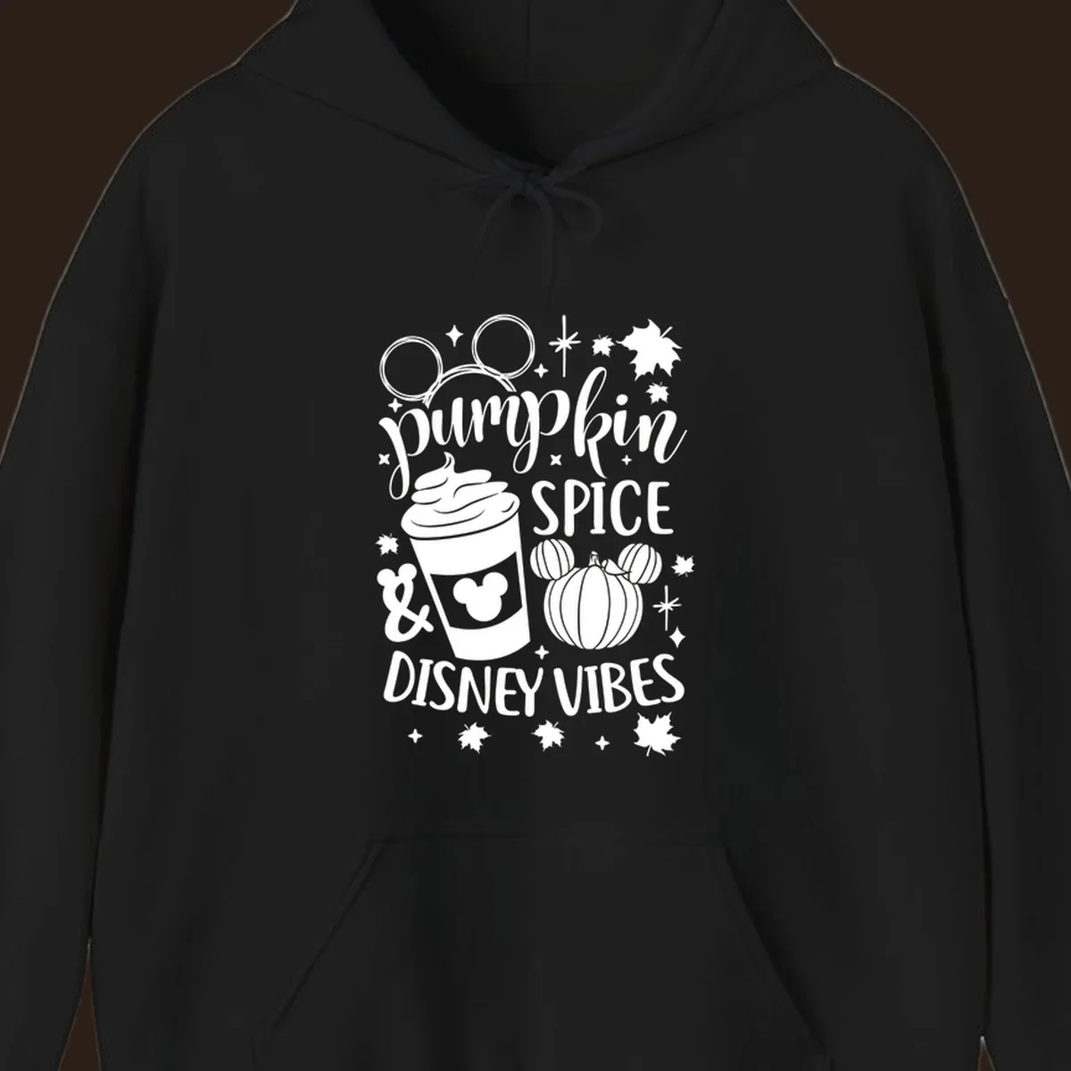 Pumpkin spice and Disney vibes text with Mickey ears, coffee cup, and pumpkin graphic. Pumpkin-spice-disney.