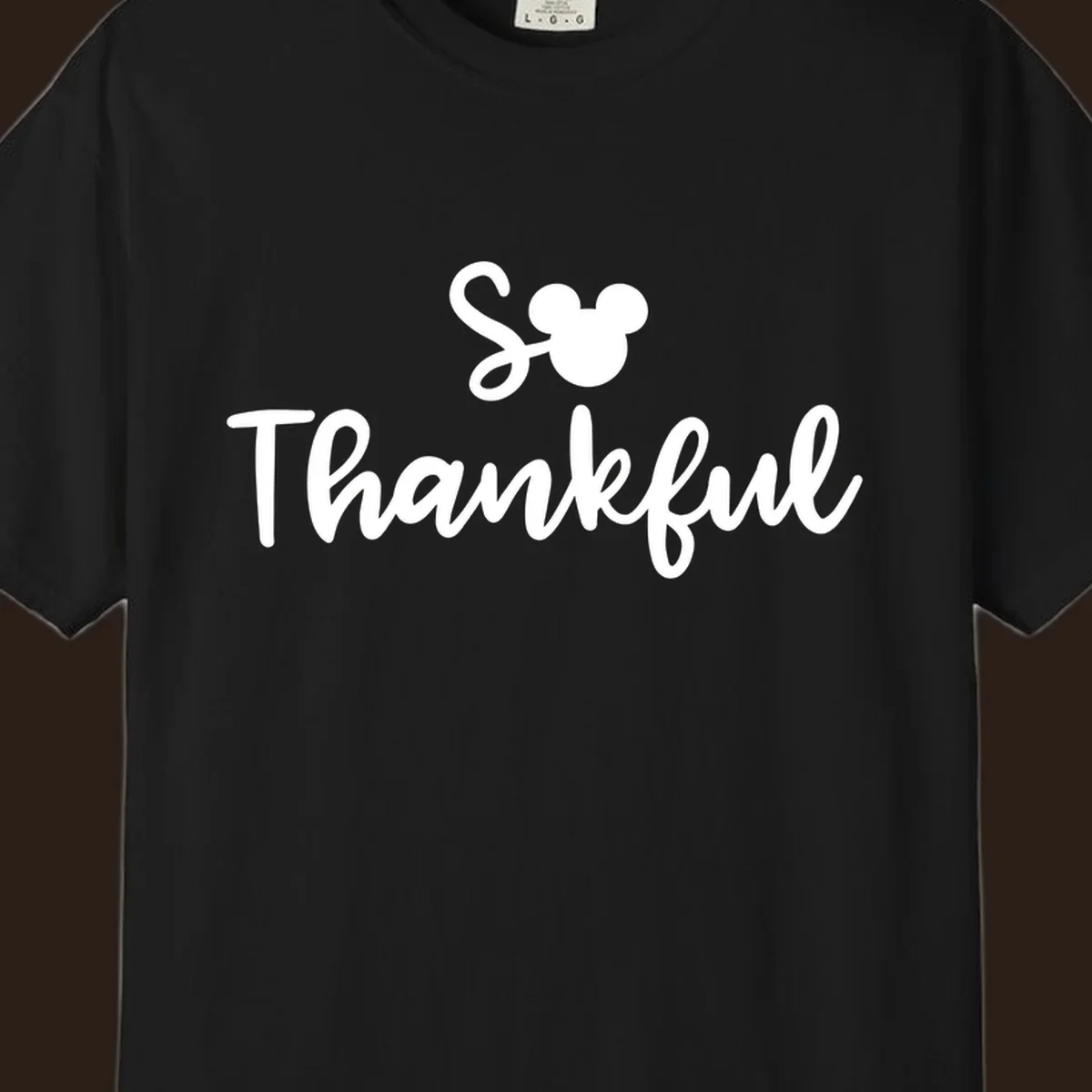 Disney Thanksgiving 'So Thankful' text with Mickey Mouse ears.