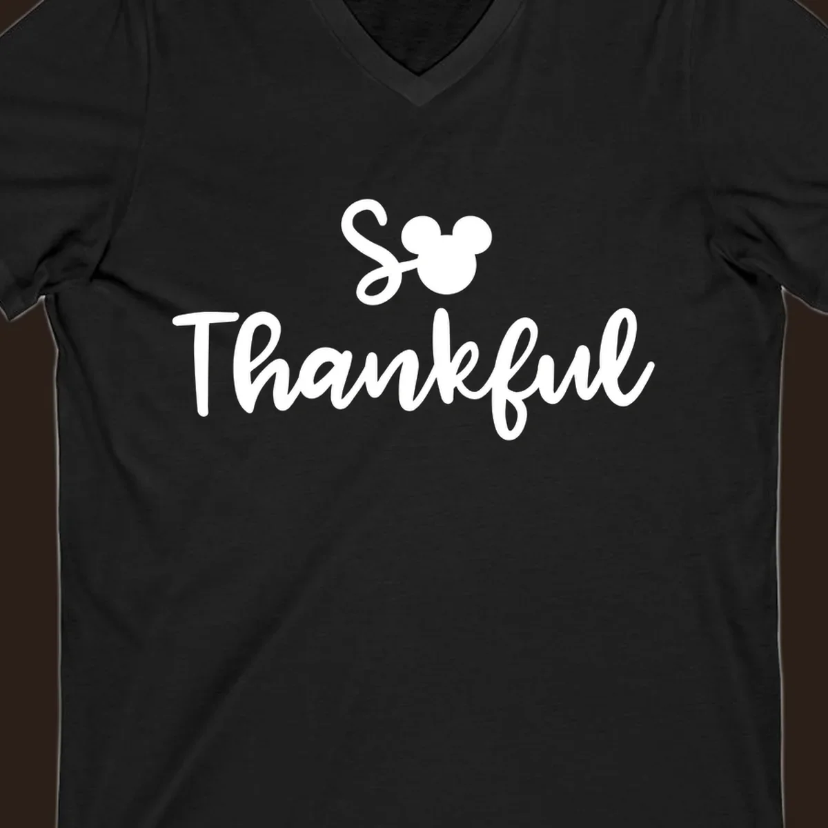 Disney Thanksgiving 'So Thankful' text with Mickey Mouse ears.