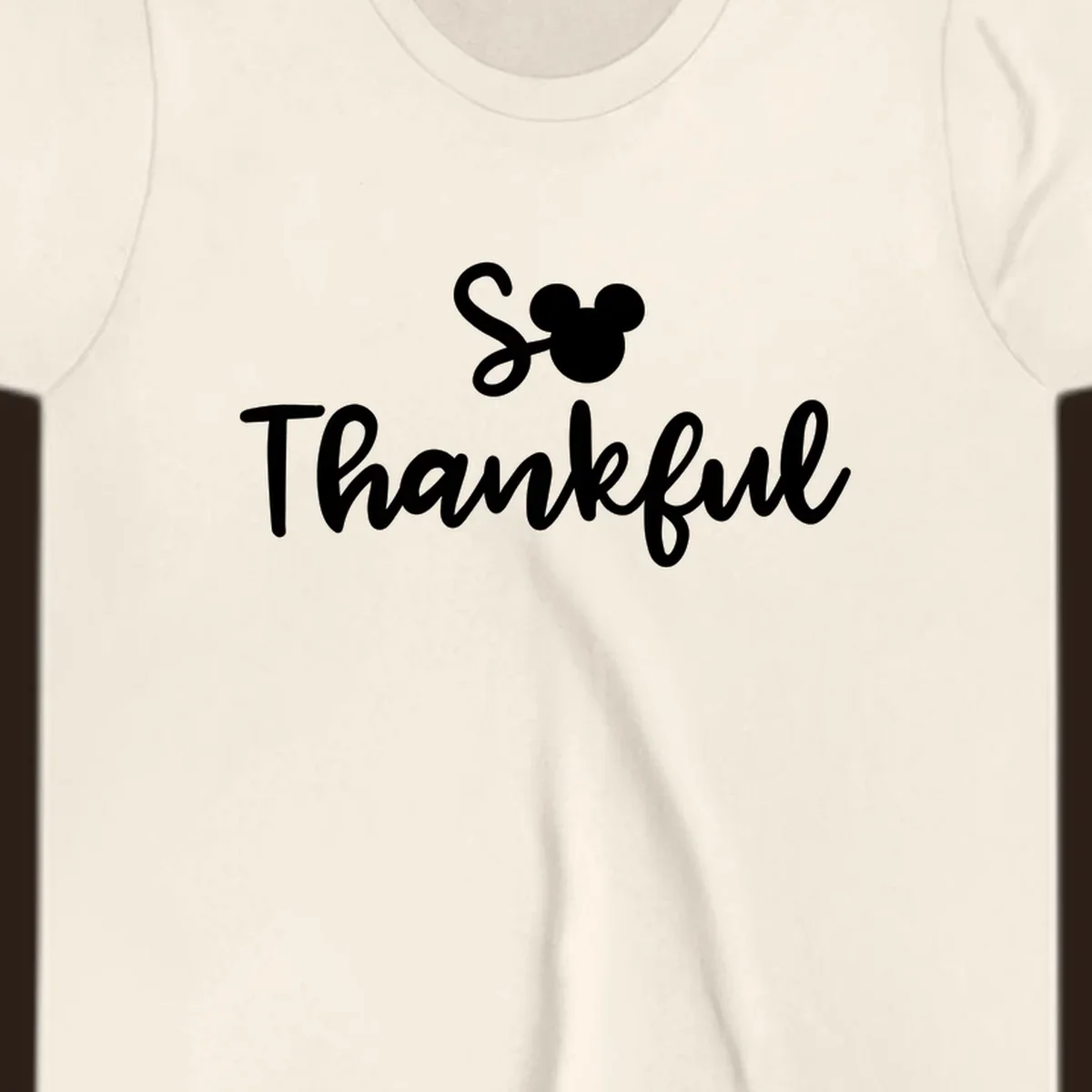 Disney Thanksgiving 'So Thankful' text with Mickey Mouse ears.