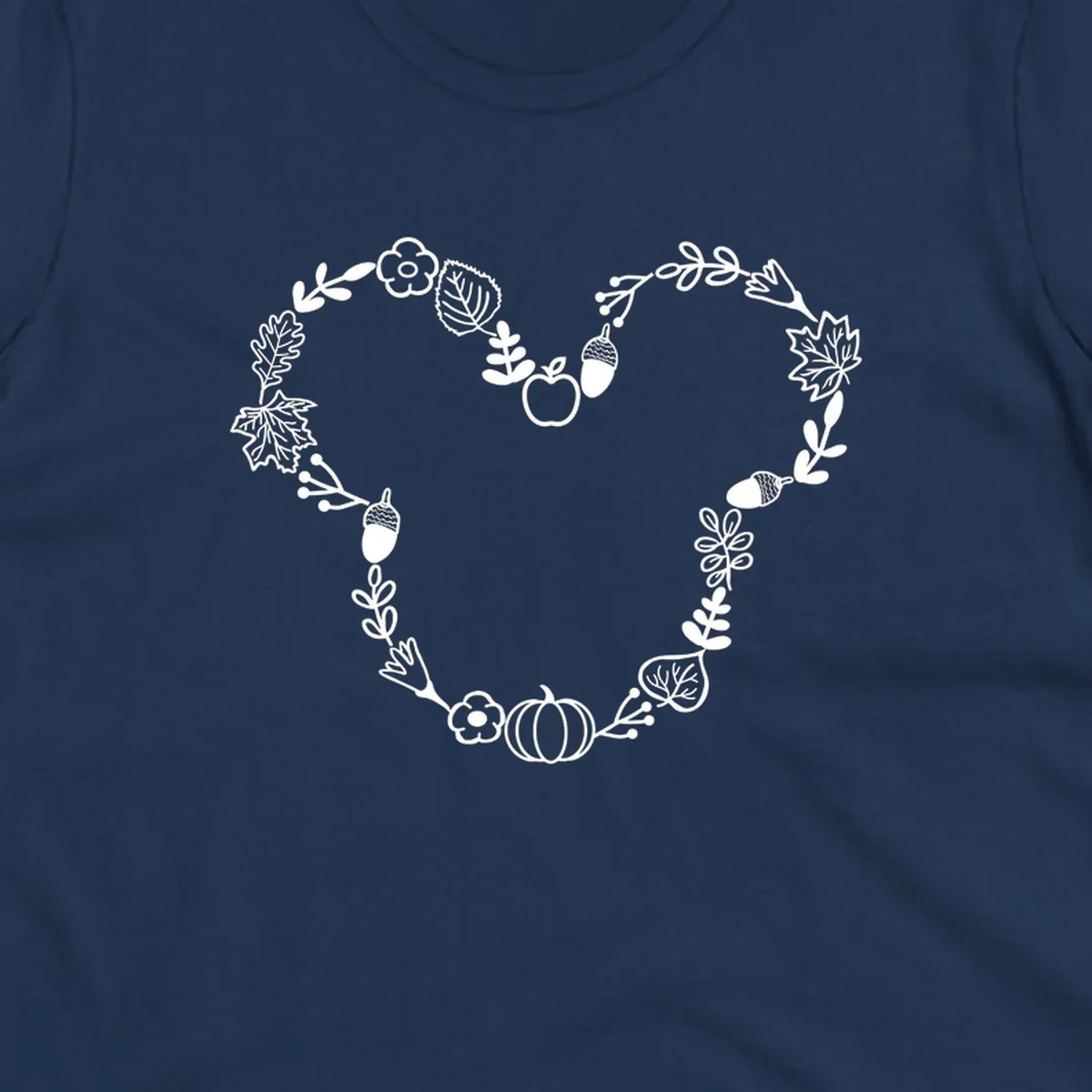 Heart shaped autumn wreath with leaves, acorns, pumpkin, and flowers. Outline design.