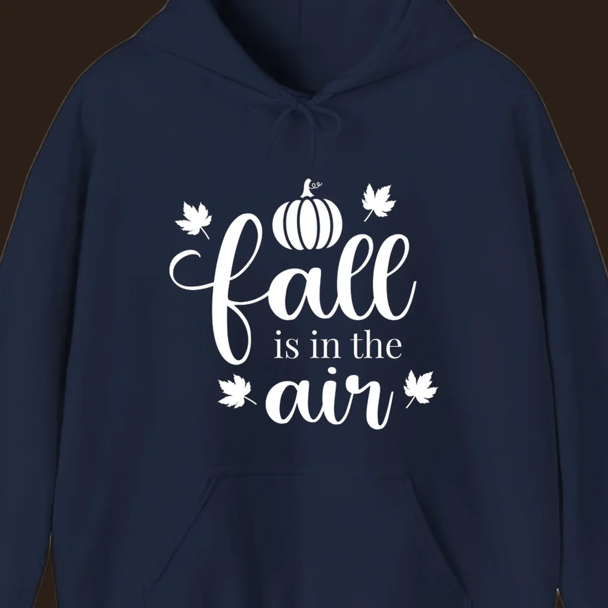 Fall is in the air phrase with pumpkin and maple leaves graphic.