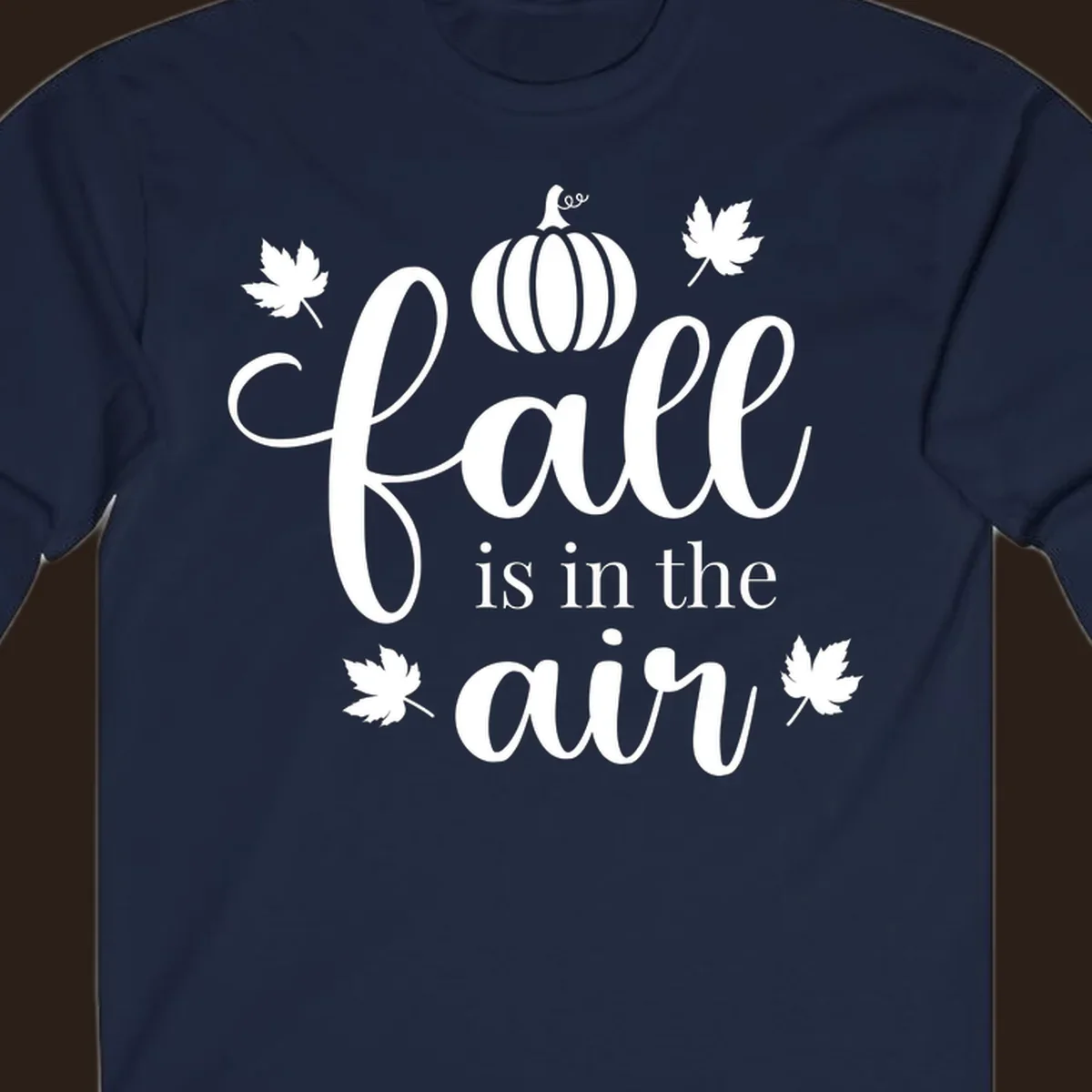 Fall is in the air phrase with pumpkin and maple leaves graphic.