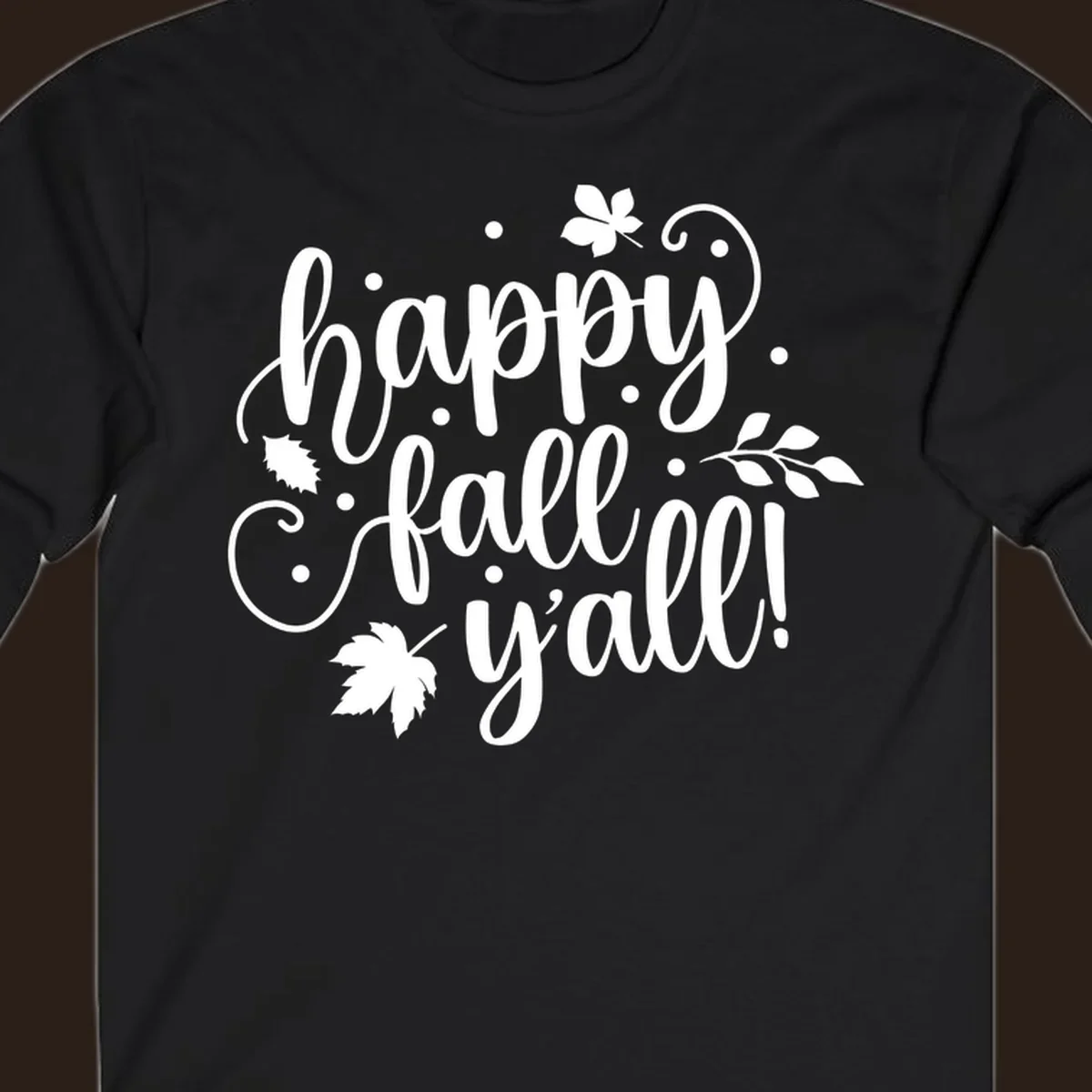 Happy Fall Y'all script design with maple leaves and swirls.