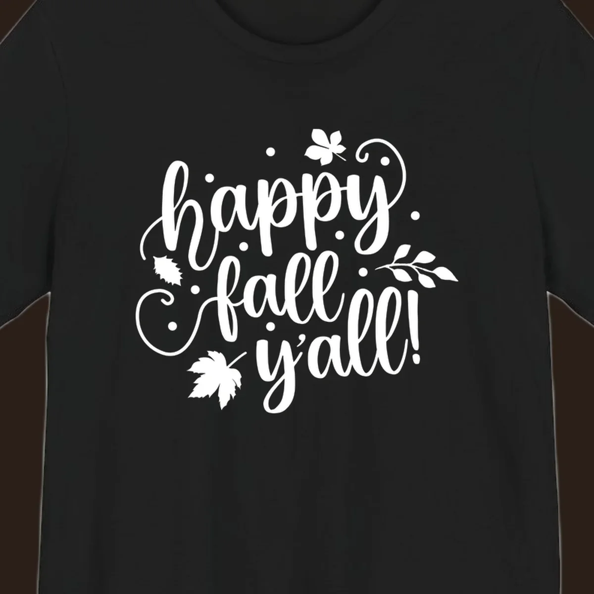 Happy Fall Y'all script design with maple leaves and swirls.