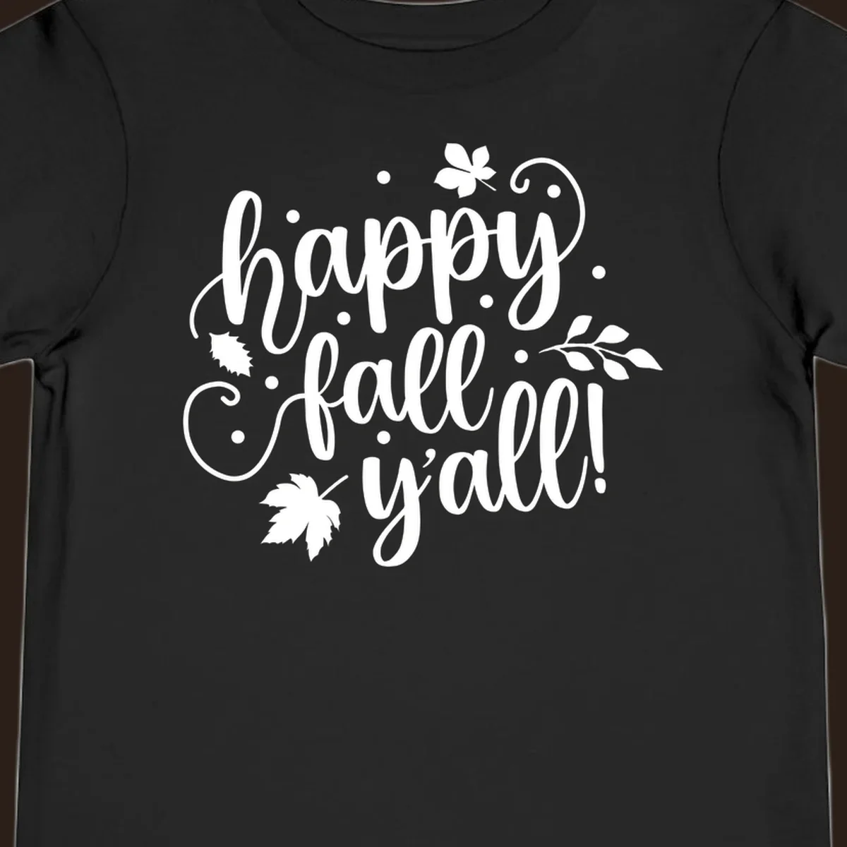 Happy Fall Y'all script design with maple leaves and swirls.