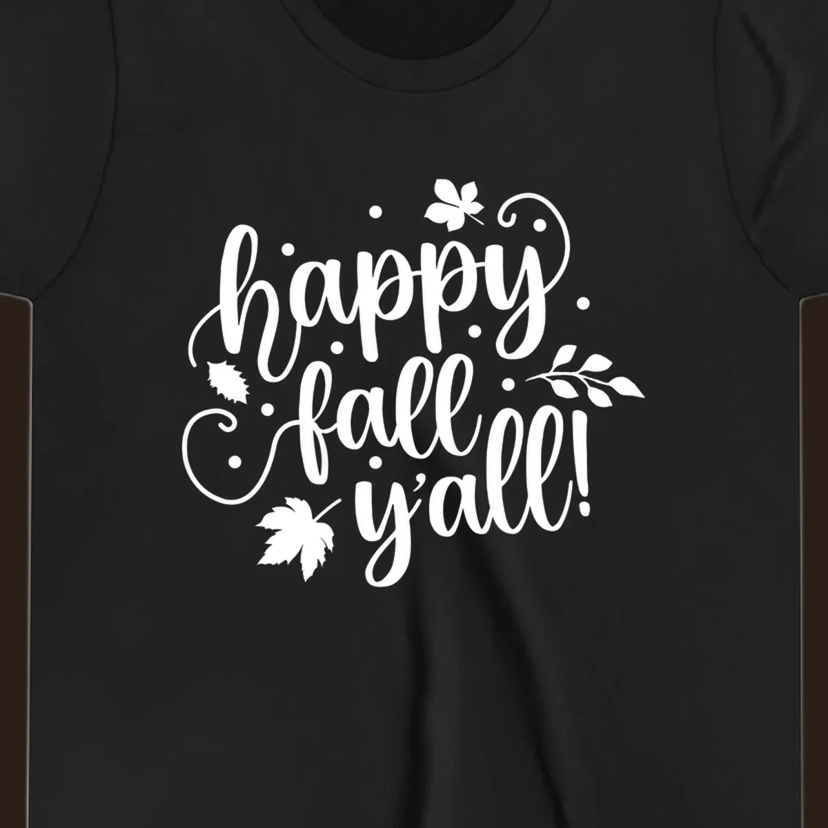 Happy Fall Y'all script design with maple leaves and swirls.