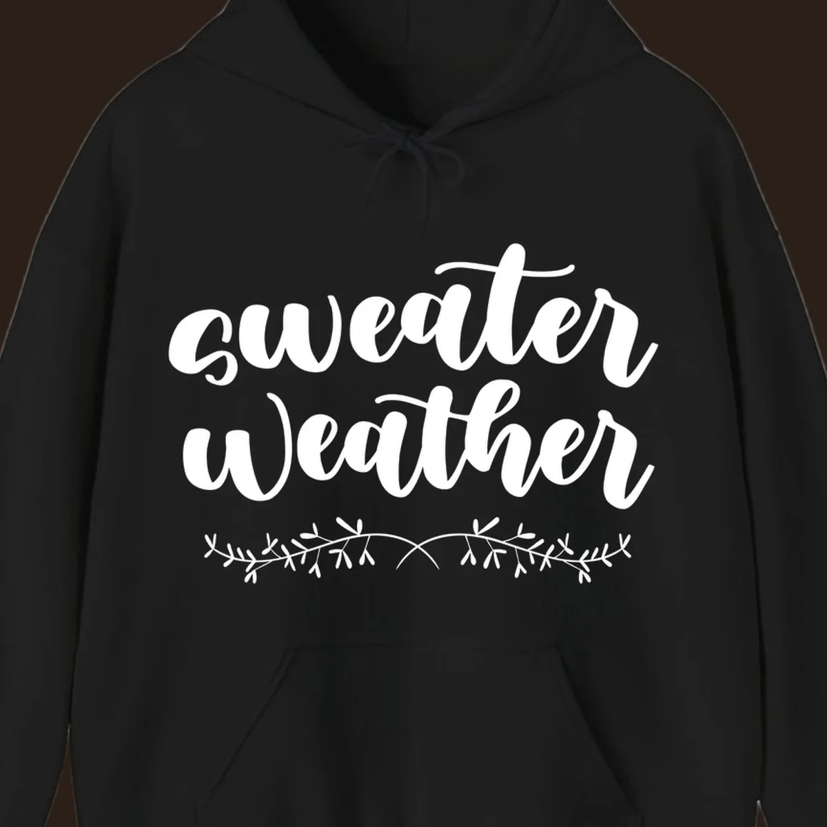 Sweater Weather text in white script font with leafy vine accent.