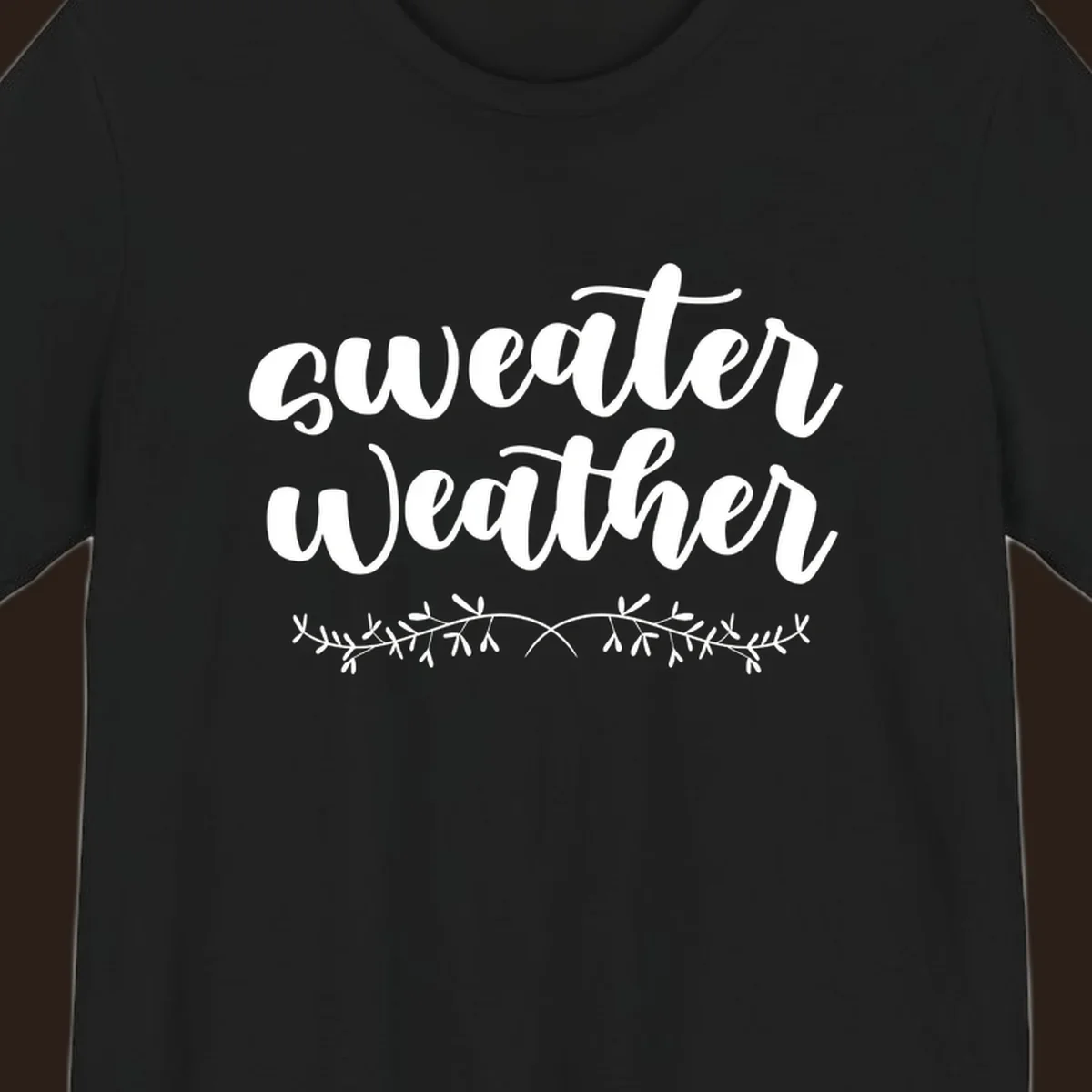 Sweater Weather text in white script font with leafy vine accent.