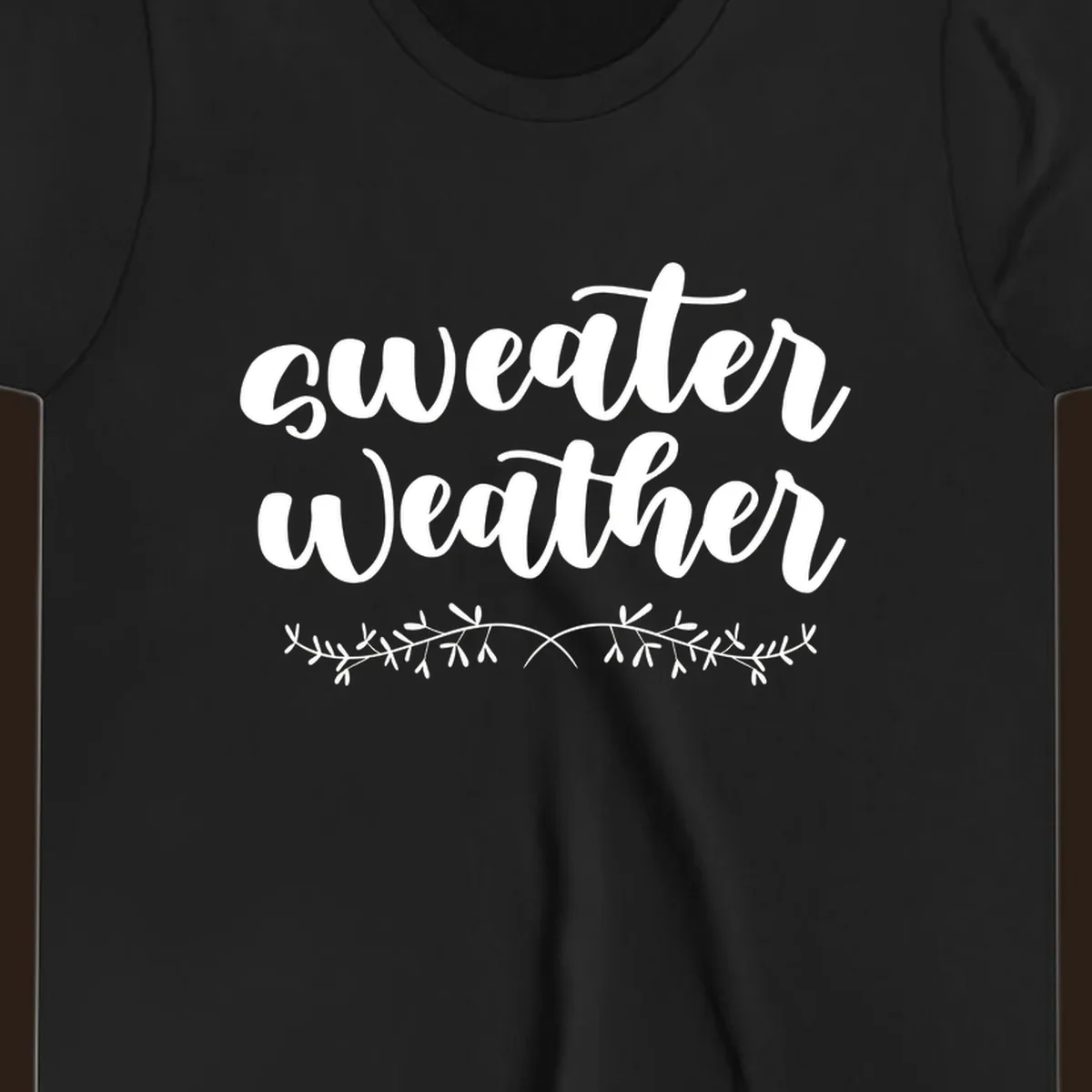 Sweater Weather text in white script font with leafy vine accent.