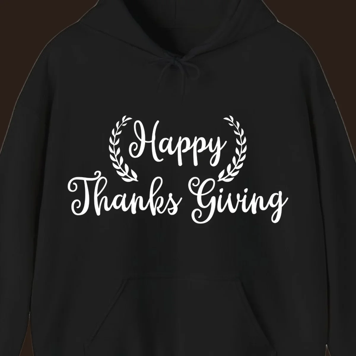 Happy Thanksgiving text with a laurel wreath, in white on black and black on white.