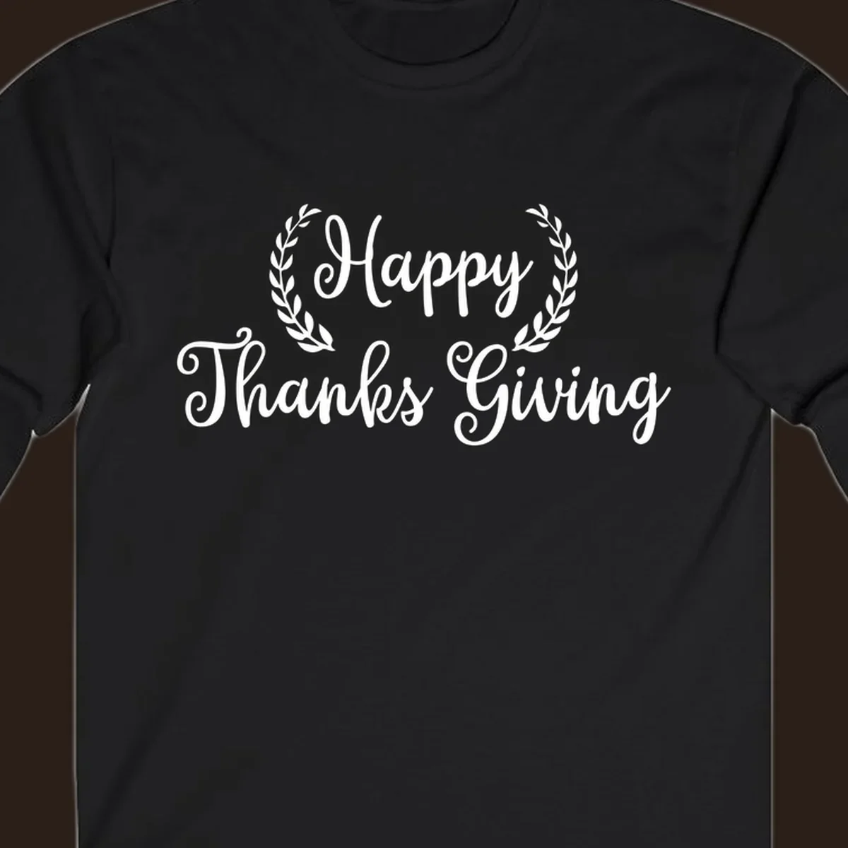 Happy Thanksgiving text with a laurel wreath, in white on black and black on white.