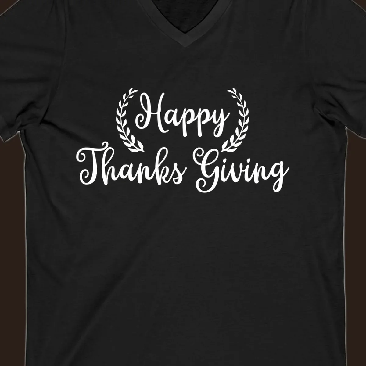 Happy Thanksgiving text with a laurel wreath, in white on black and black on white.