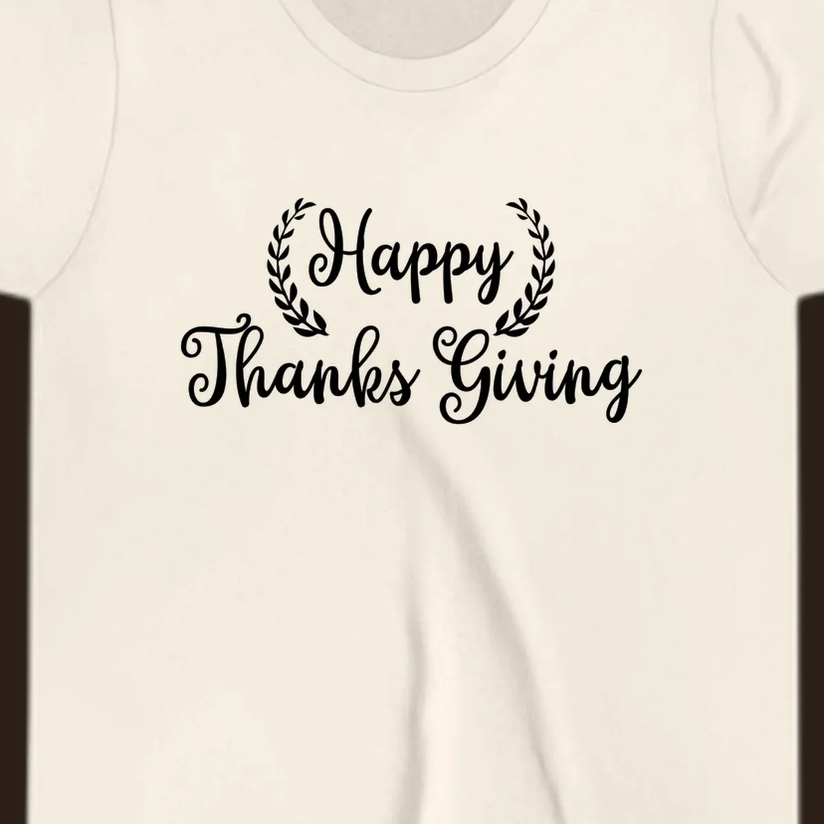 Happy Thanksgiving text with a laurel wreath, in white on black and black on white.