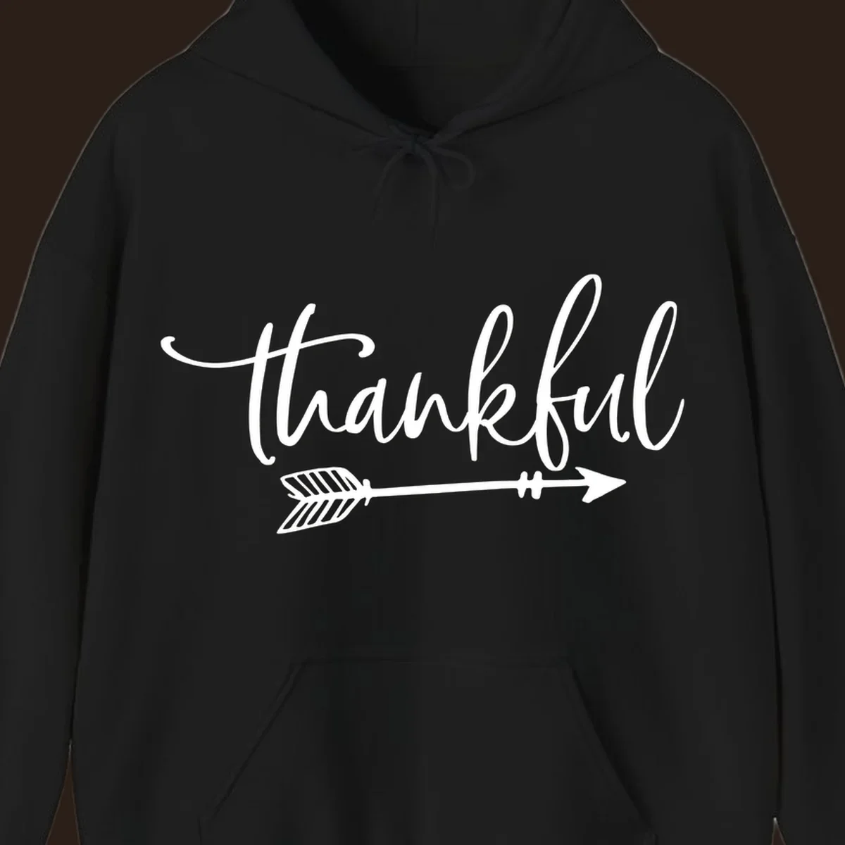 Thankful text with an arrow graphic, Thanksgiving theme.