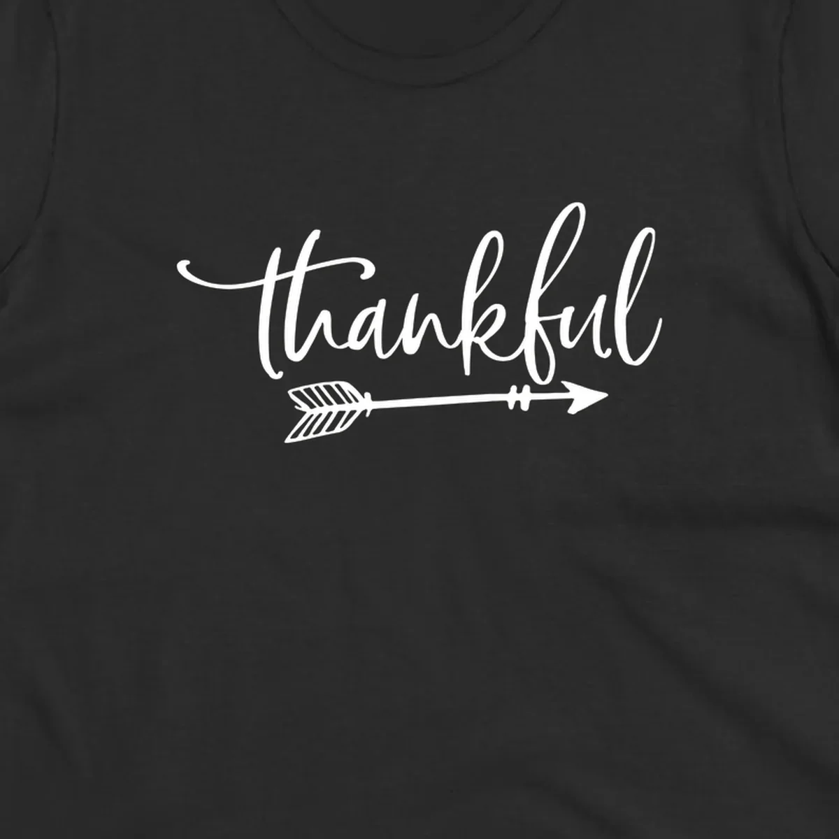 Thankful text with an arrow graphic, Thanksgiving theme.