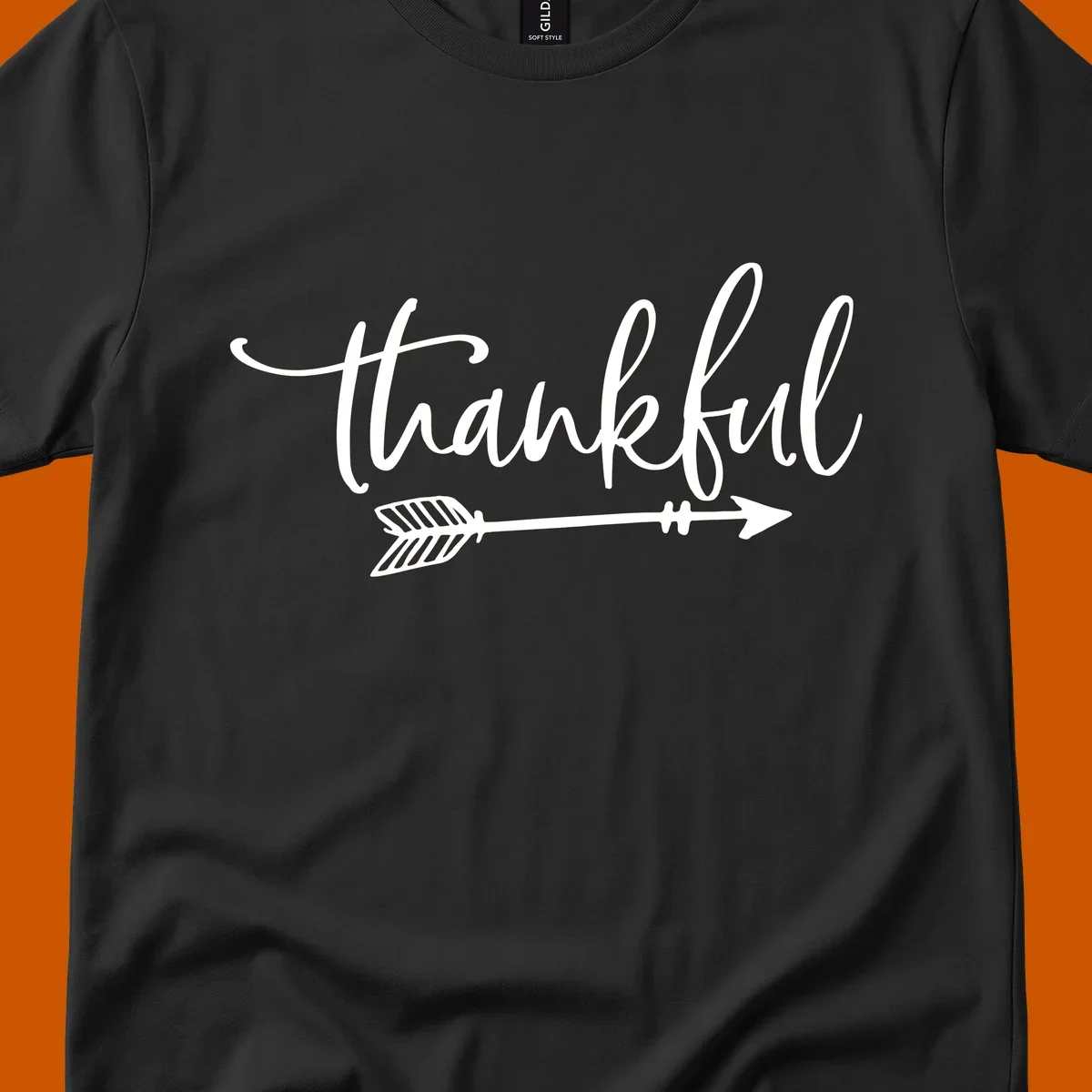 Thankful text with an arrow graphic, Thanksgiving theme.