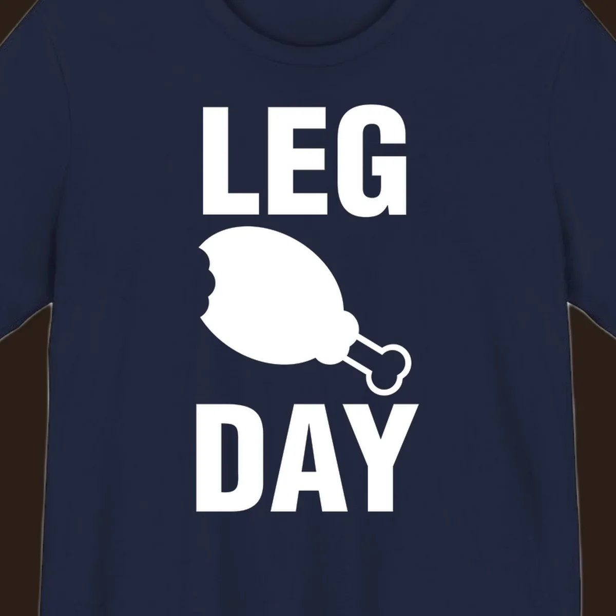 Leg Day text with a bitten chicken leg graphic. Humor fitness design.