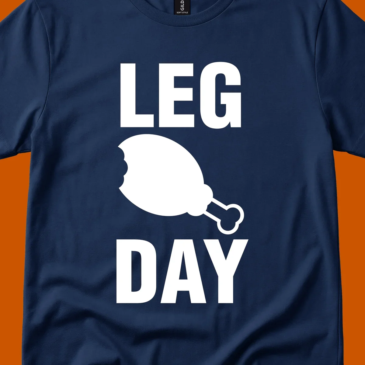 Leg Day text with a bitten chicken leg graphic. Humor fitness design.