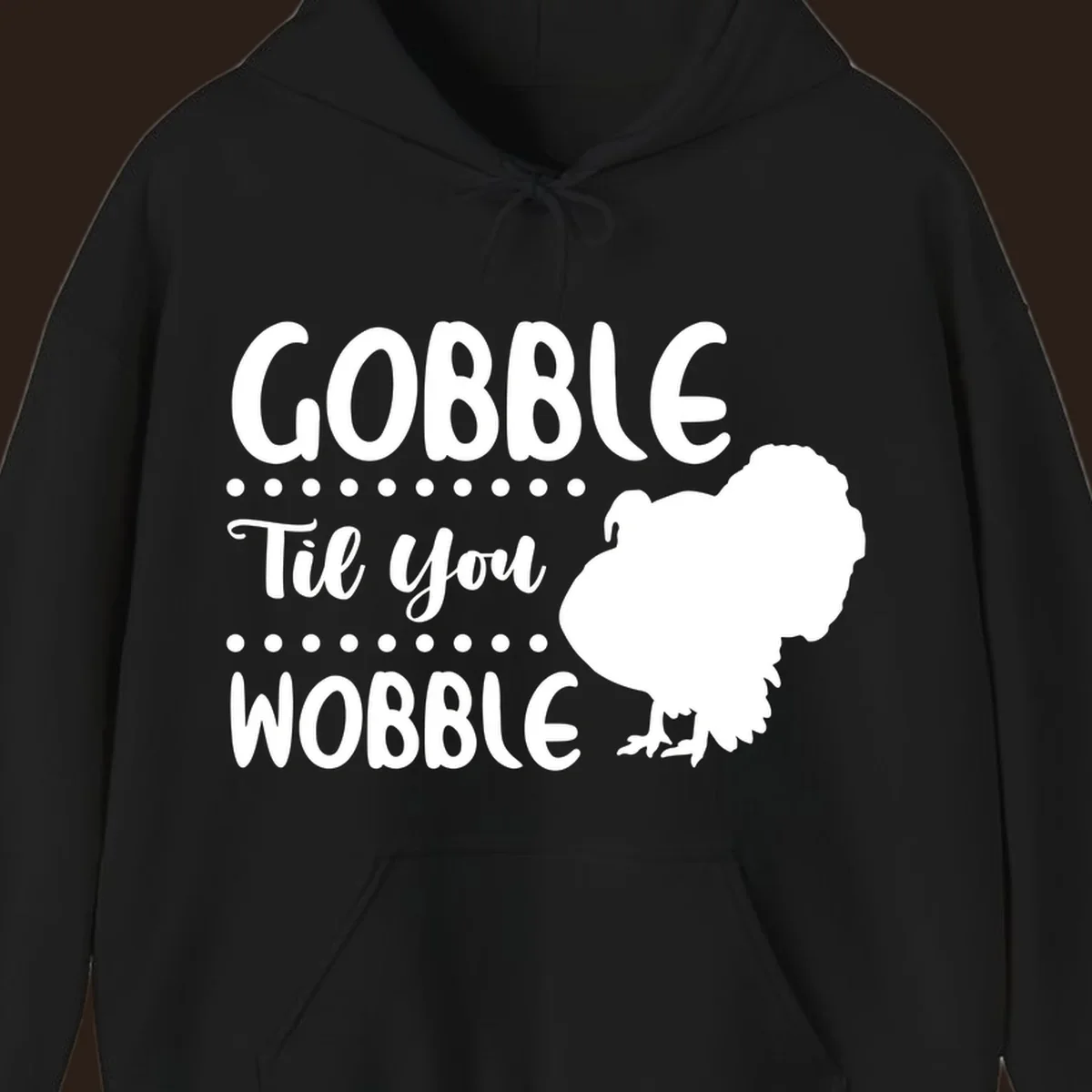 Gobble til you wobble turkey design with text and a turkey silhouette.