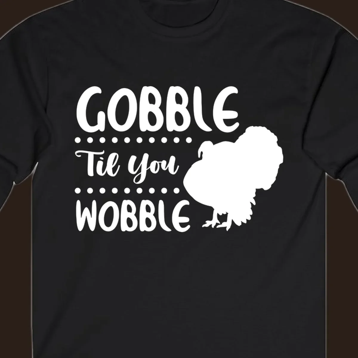 Gobble til you wobble turkey design with text and a turkey silhouette.