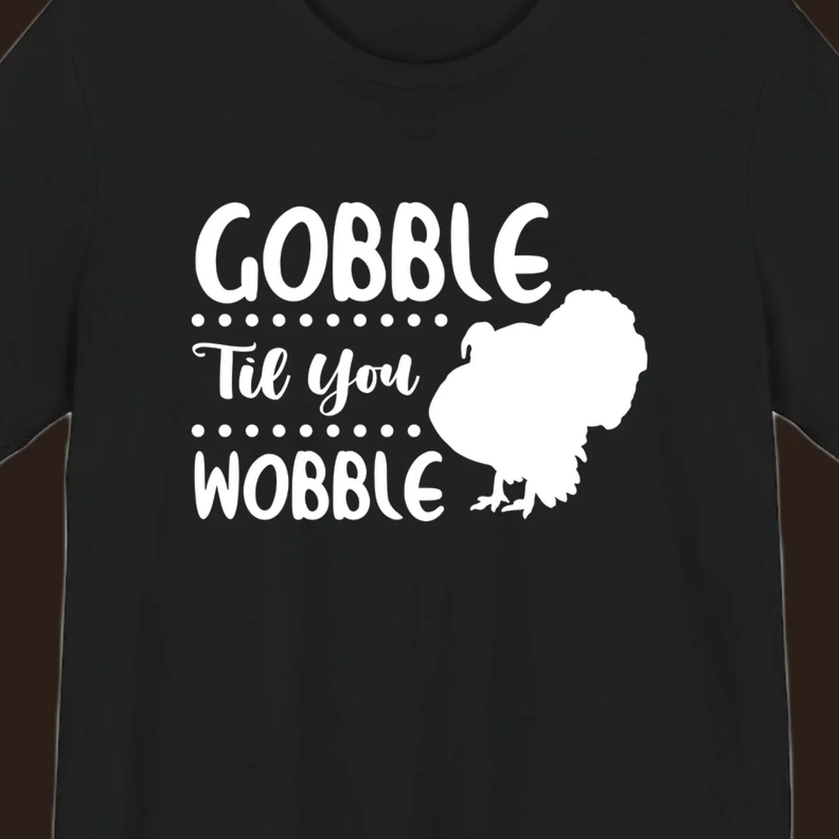 Gobble til you wobble turkey design with text and a turkey silhouette.