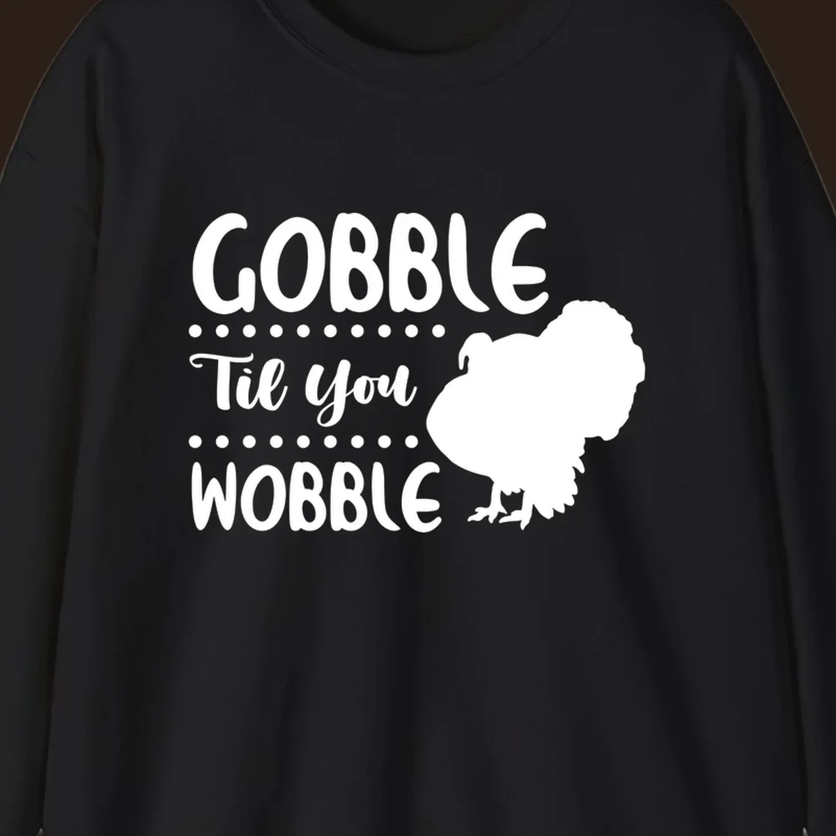 Gobble til you wobble turkey design with text and a turkey silhouette.