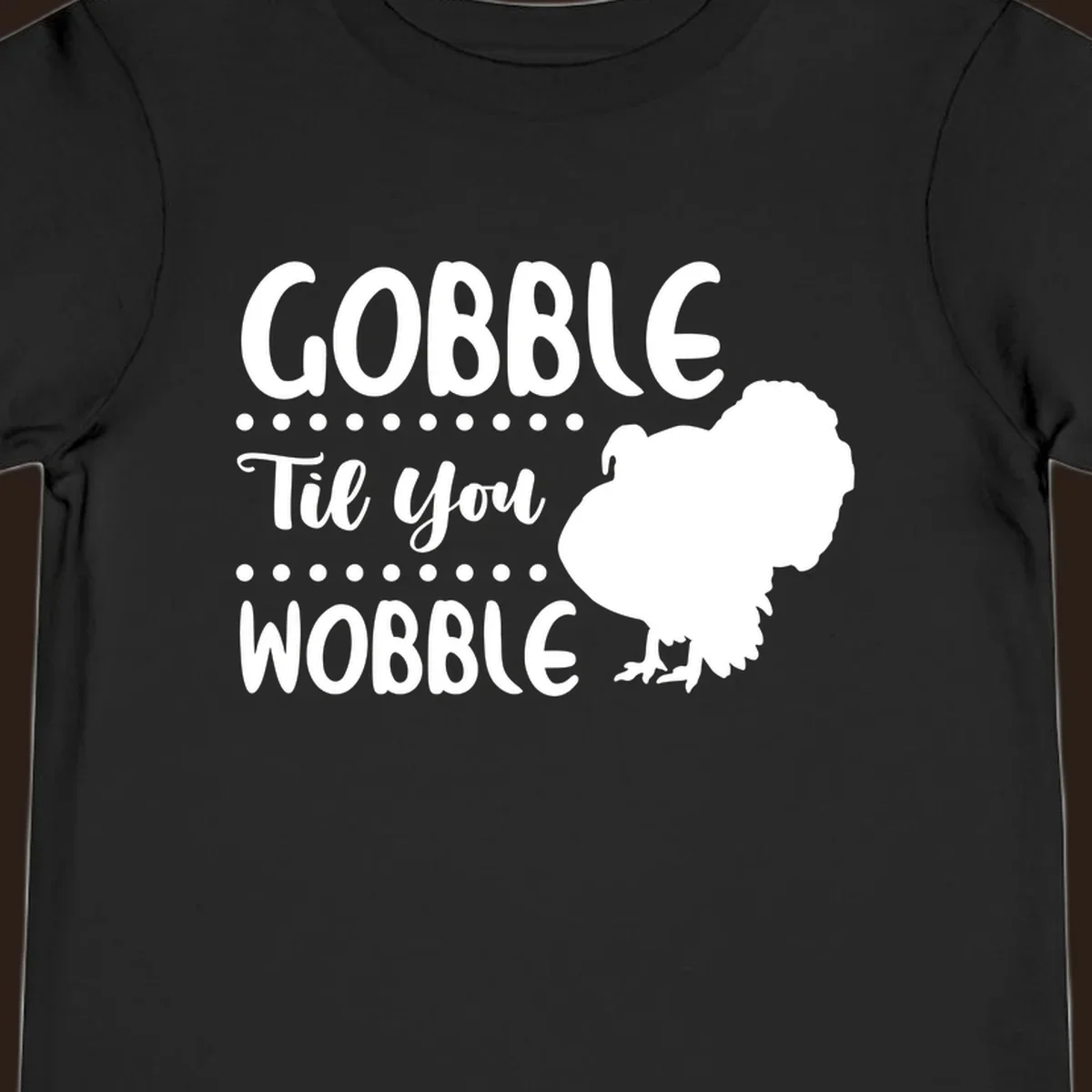 Gobble til you wobble turkey design with text and a turkey silhouette.