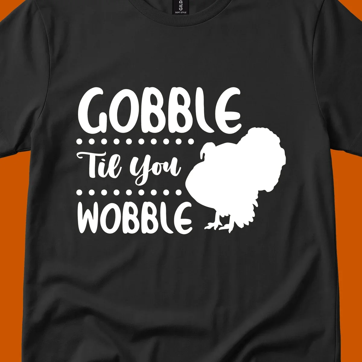 Gobble til you wobble turkey design with text and a turkey silhouette.