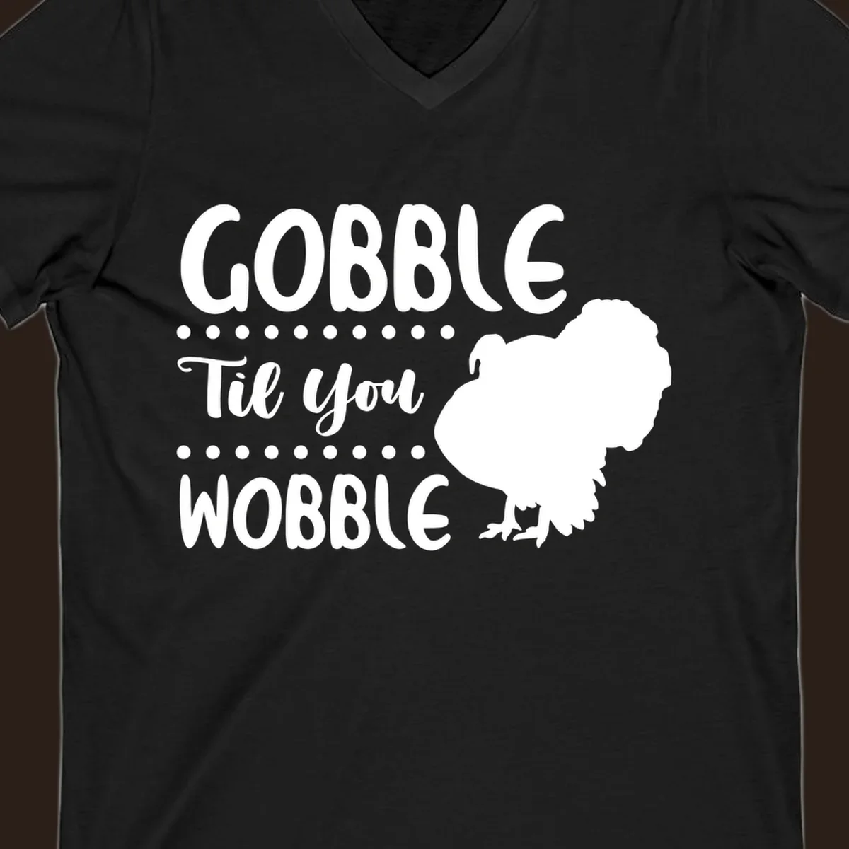 Gobble til you wobble turkey design with text and a turkey silhouette.