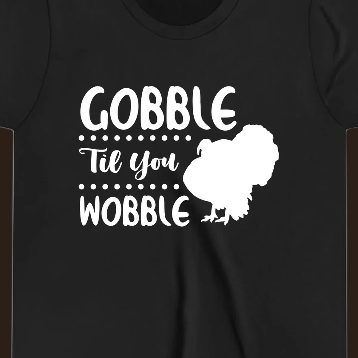 Gobble til you wobble turkey design with text and a turkey silhouette.