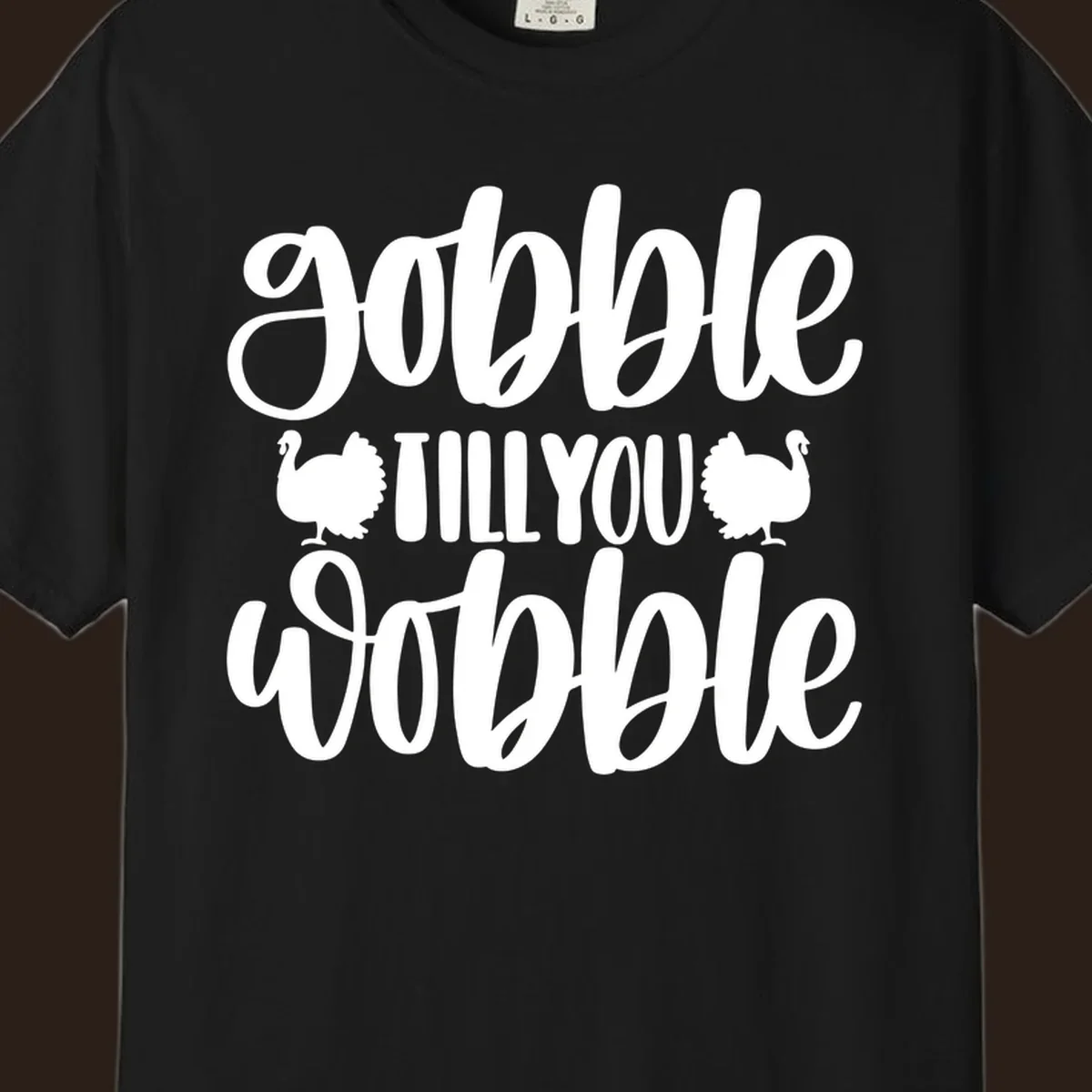 Gobble till you wobble text with turkey illustrations, Thanksgiving design.